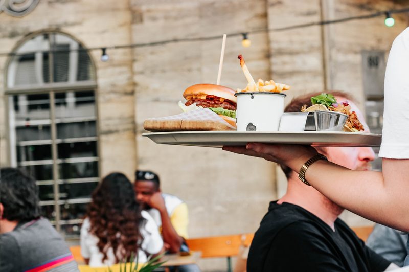waiter with food on tray