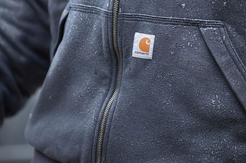 The Carhartt logo on a sweater.