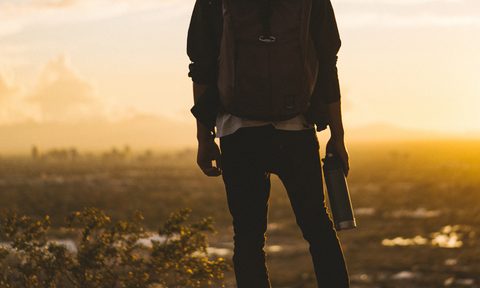 travel backpack water bottle sunset