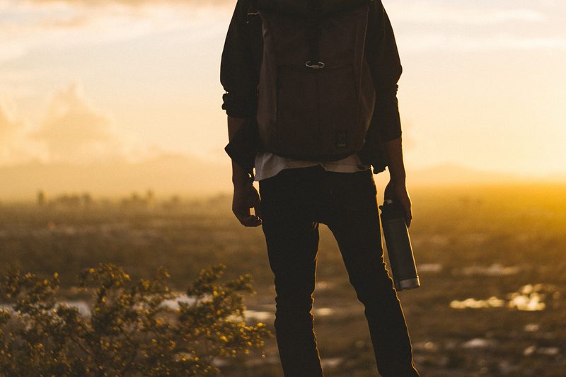 travel backpack water bottle sunset