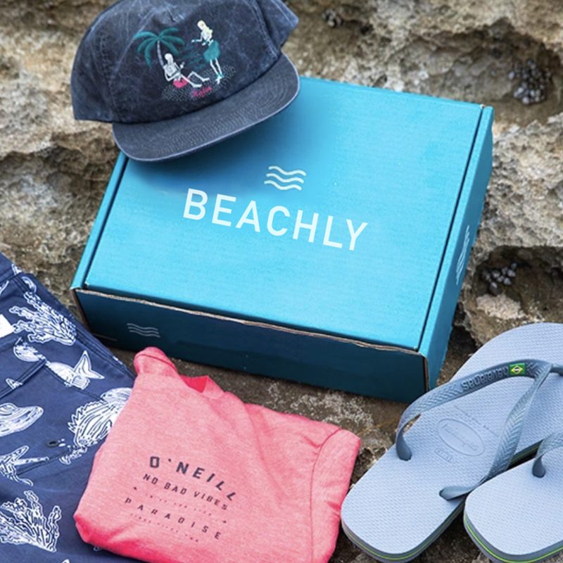 The Beachly box with flip-flops and beach gear.