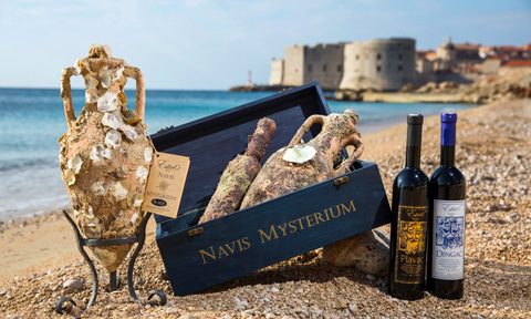edivo vino bottles on beach