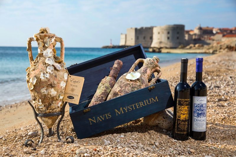 edivo vino bottles on beach