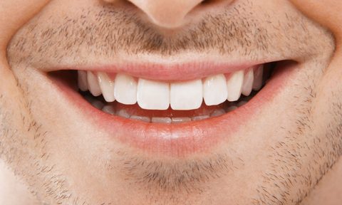 best power dental flossers on amazon man smiling