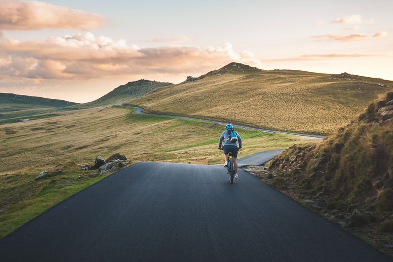 man traveling on bike