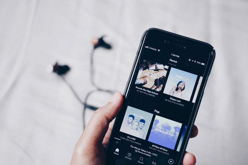 person streaming music on phone