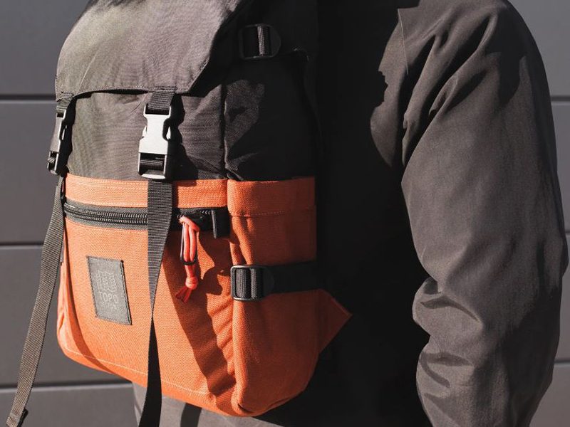 A model carrying a backpack.