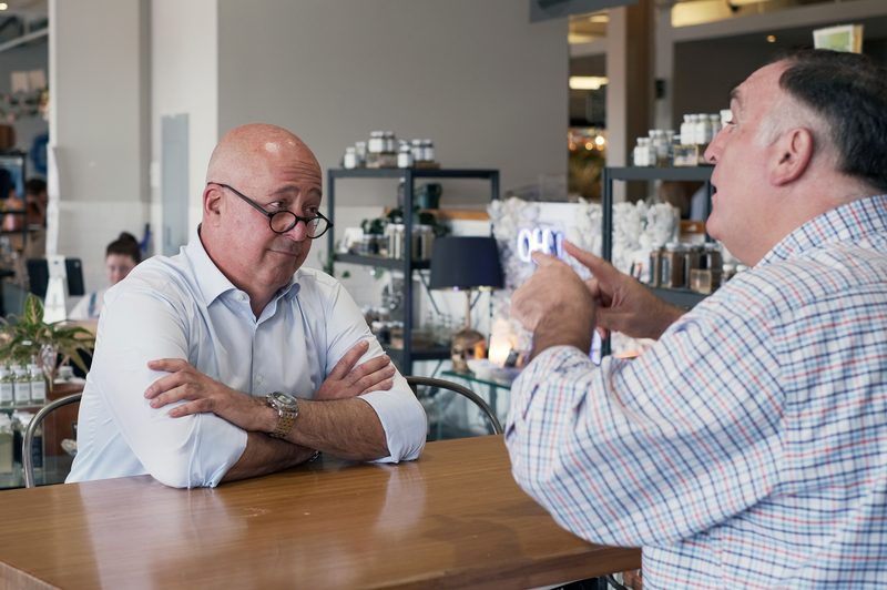 andrew zimmern sitting for an interview
