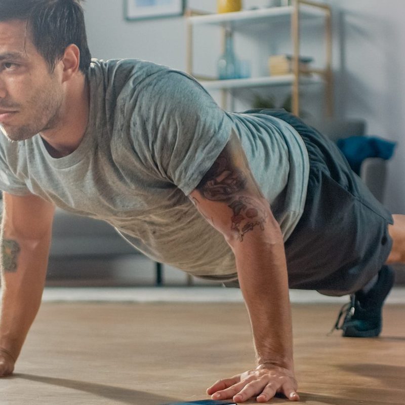 Man performing a burpee.