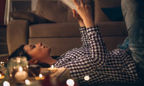 reading mystery book woman