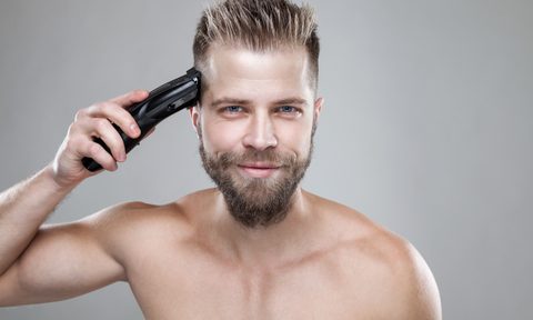 Man cutting own hair
