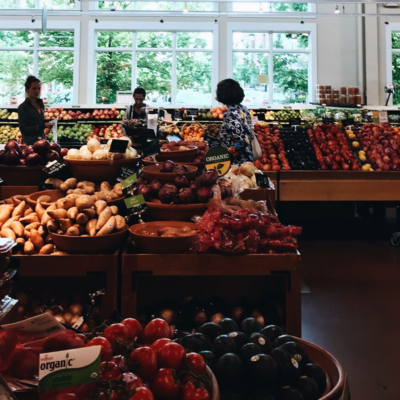 People at a grocery store produce section