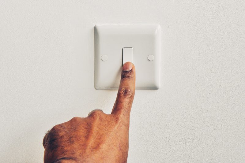 light switch hand saving energy