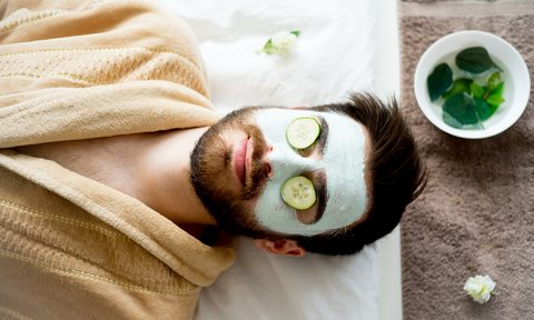 Man wearing a clay mask