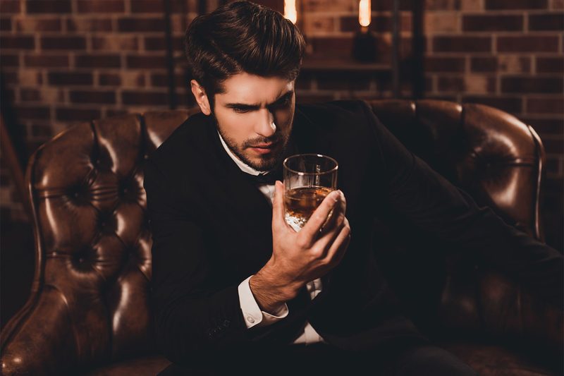 man drinking whiskey