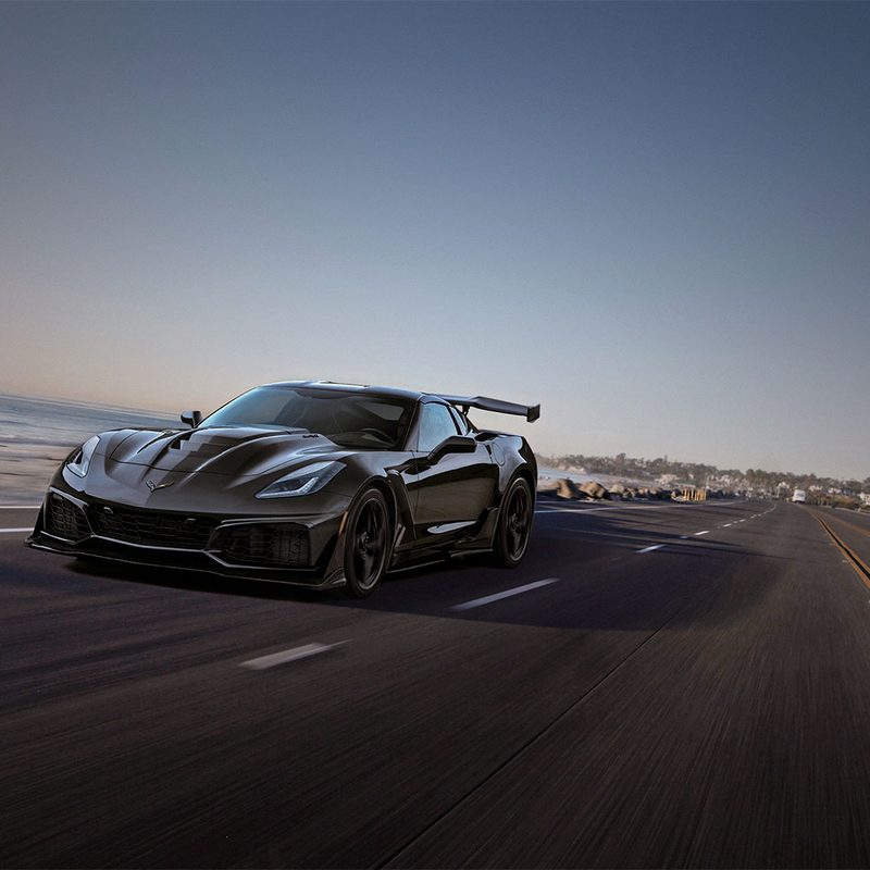 Chevrolet Corvette ZR1 front end angle from driver's side driving down the road.