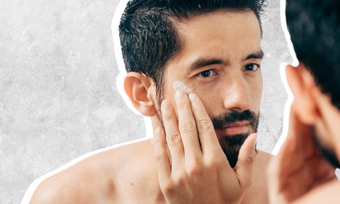 Man using face moisturizer