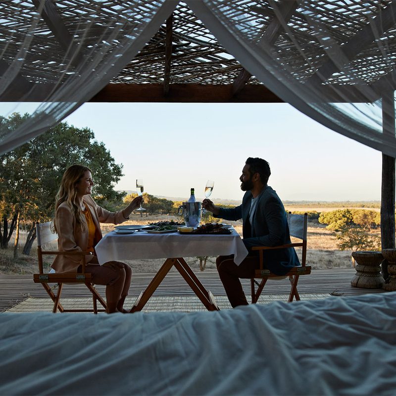 A couple enjoys an evening of dining al fresco.