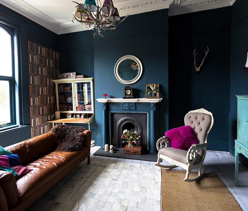 A living room with high ceilings and architectural features.