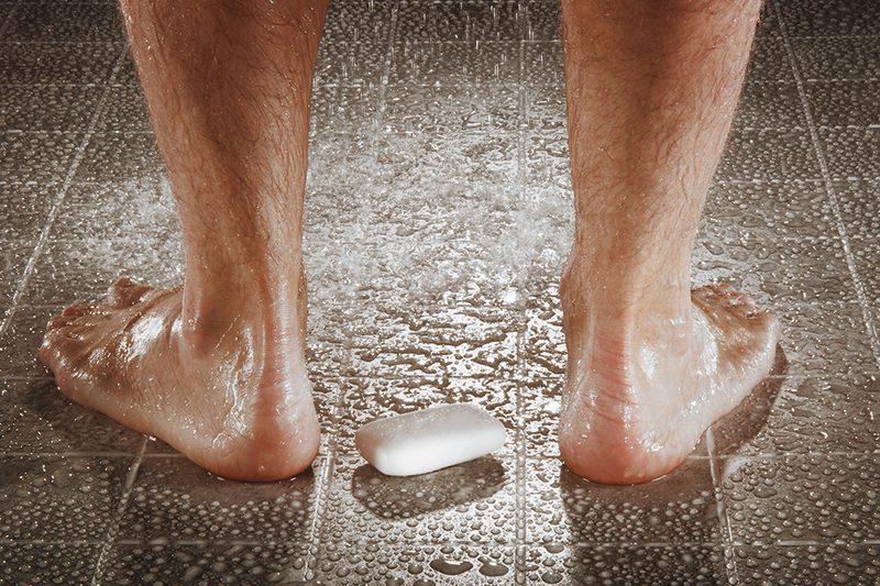Man washing his feet.
