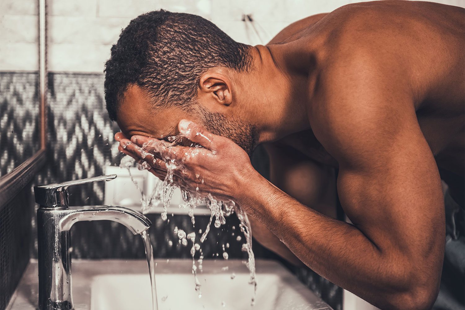 a man washing his face
