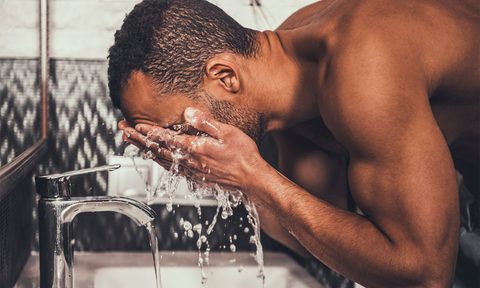 a man washing his face