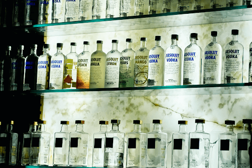 Liquor bottles on a bar shelf