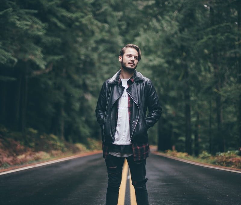 Man in leather jacket in the road