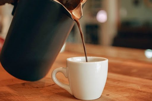 Coffee pouring into a cup
