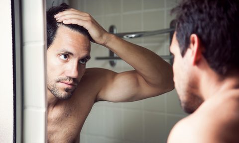 Man treating stress-related hair loss