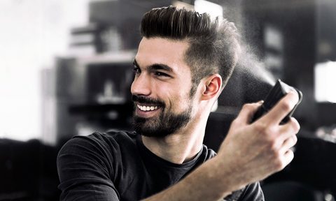 Man using hair spray