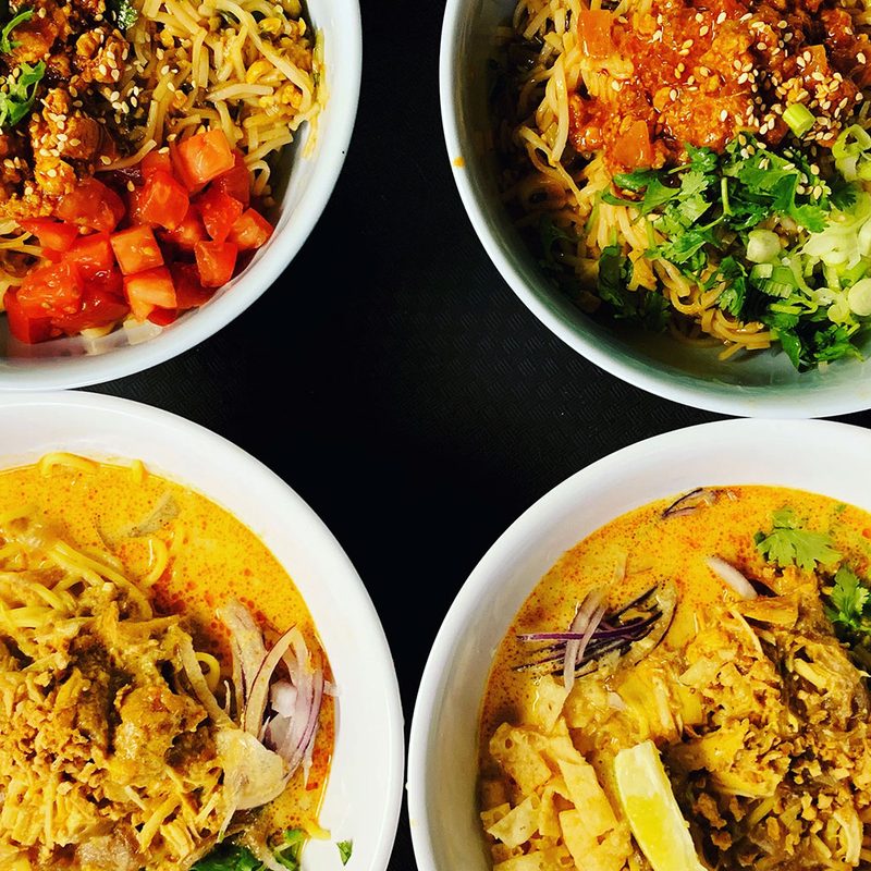 A shot of four dishes from Top Burmese in Portland, Oregon