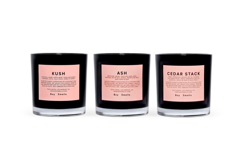 Boy smells candles.