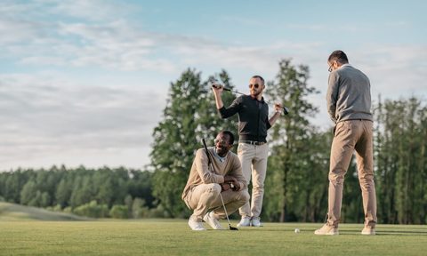 A group of friends playing golf.