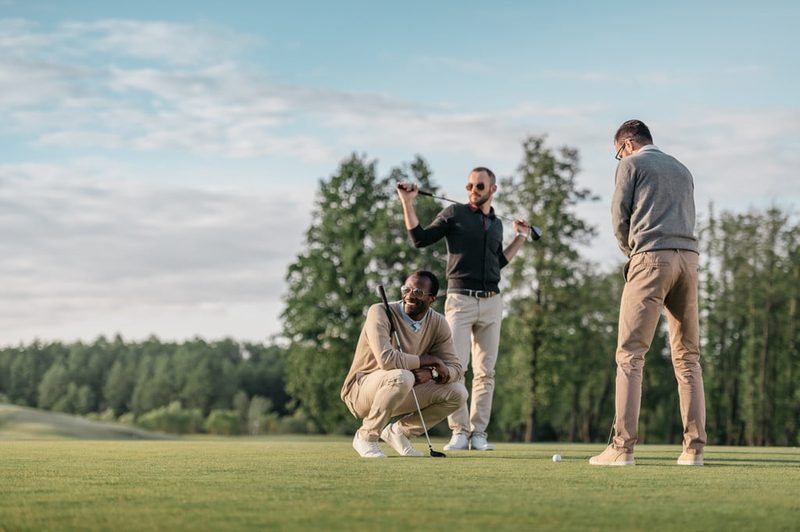 A group of friends playing golf.