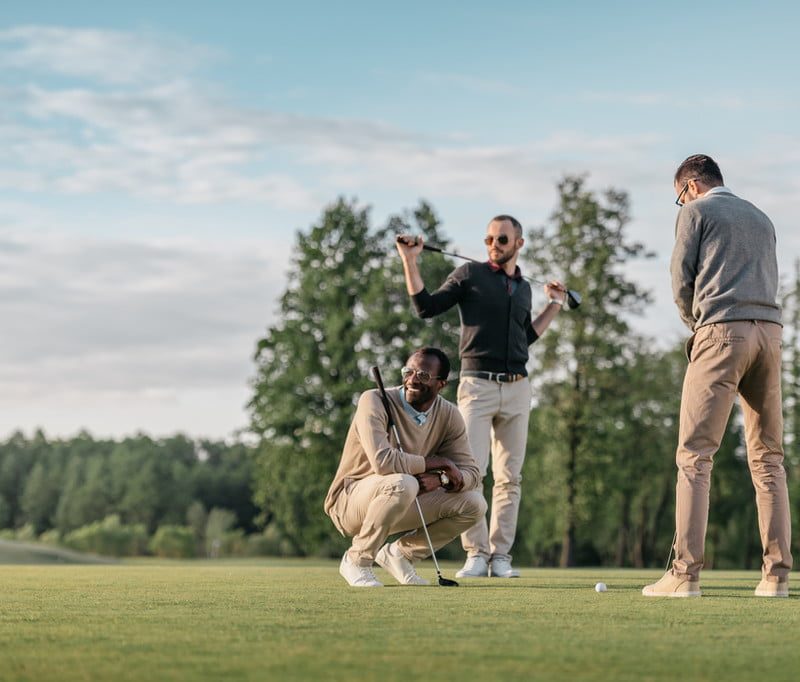 A group of friends playing golf.
