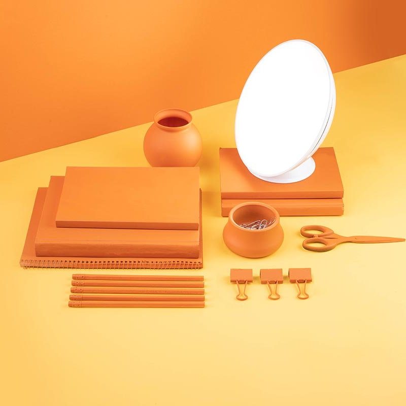 Circadian Optics Lampu Lamp with orange-themed products.