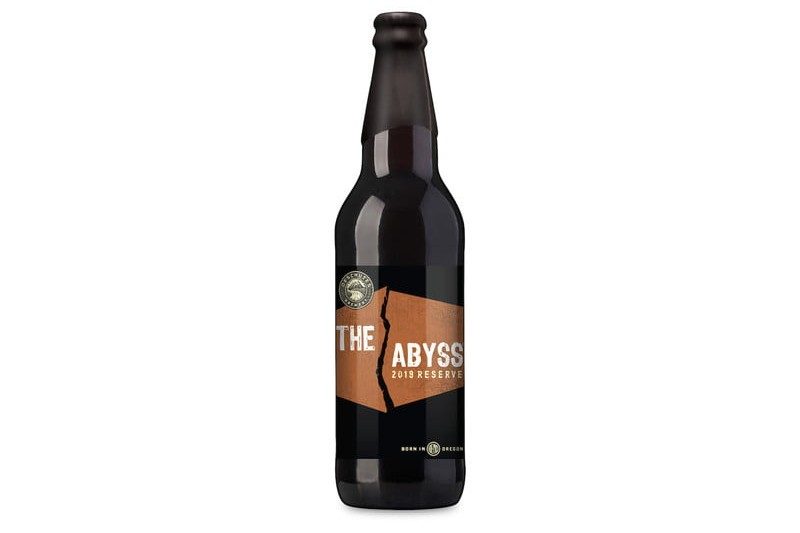 A bottle of Deschutes Abyss Beer Bottle Shot on white background.