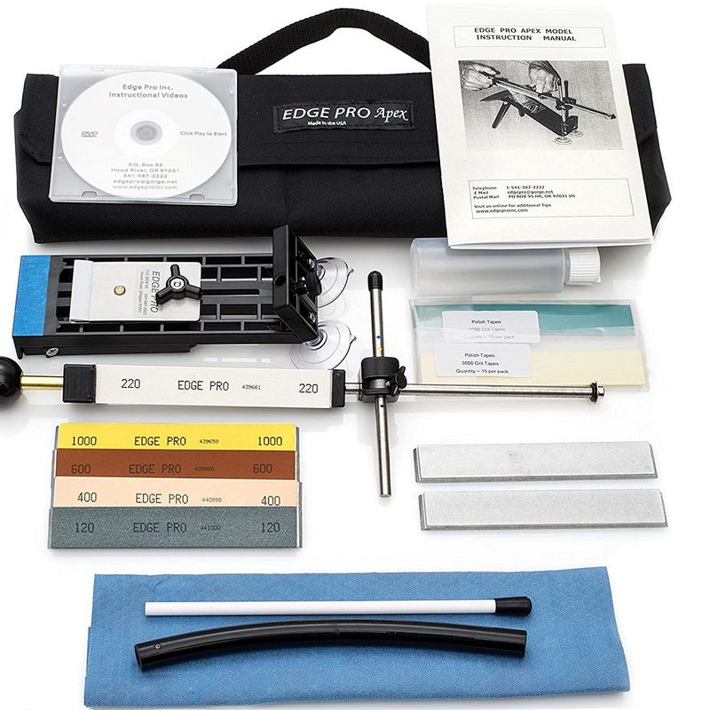 Knife sharpening kit laid out on a white background.