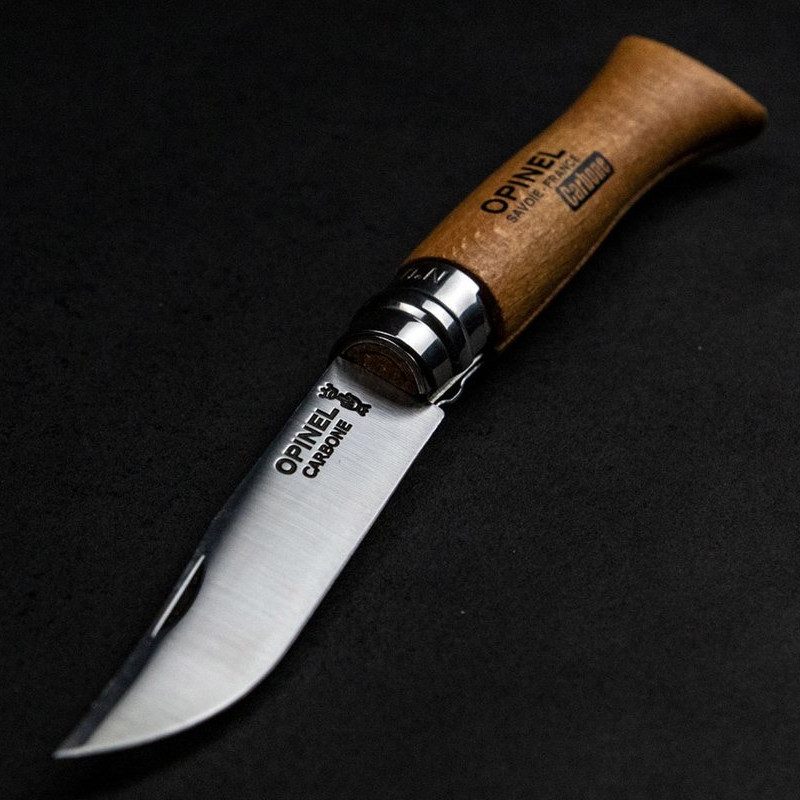 opinel knife sitting on a table.