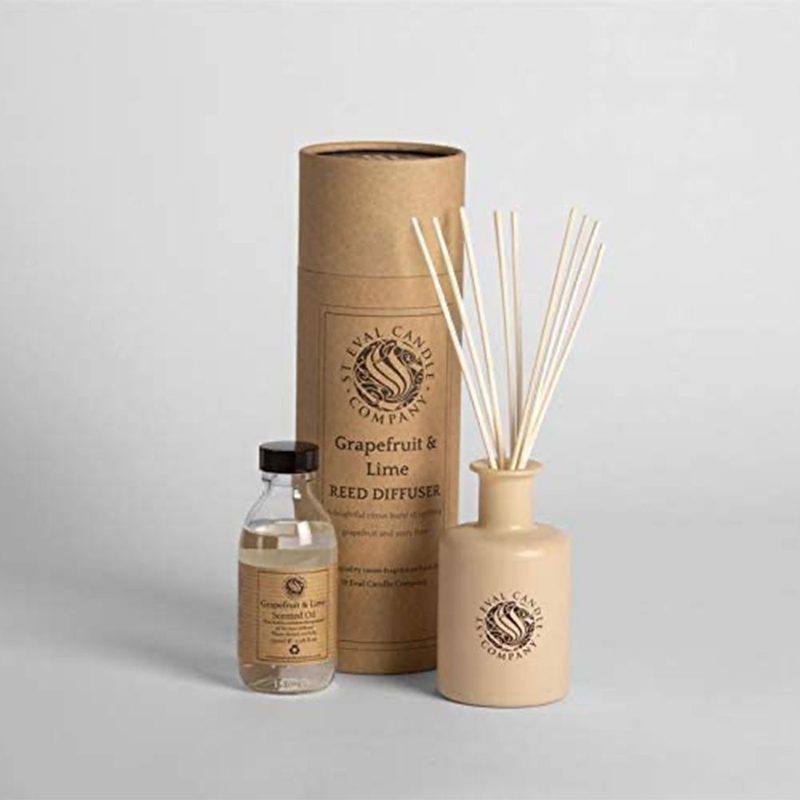 A P.F Candle Co Teakwood and Tobacco Diffuser on gray background.