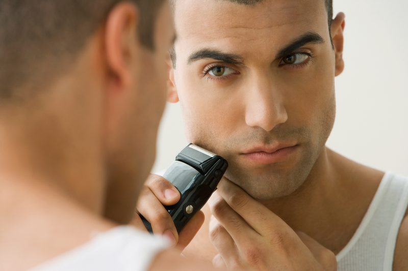 A man shaving in the mirror