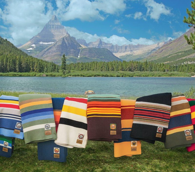 Pendleton National Park Blankets Series with a mountain view background.