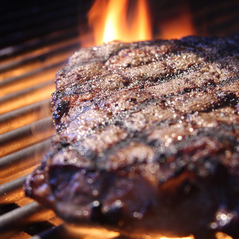 Grilled steak with flames