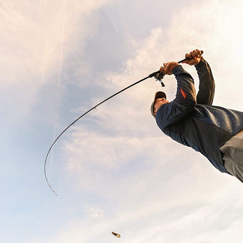 Low-angle view of a man casting a St. Croix Rods Legend Xtreme Casting Rod against the sky.