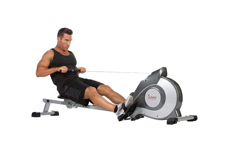 A man using Sunny Health and Fitness's Magnetic Rowing Machine with LCD Monitor.