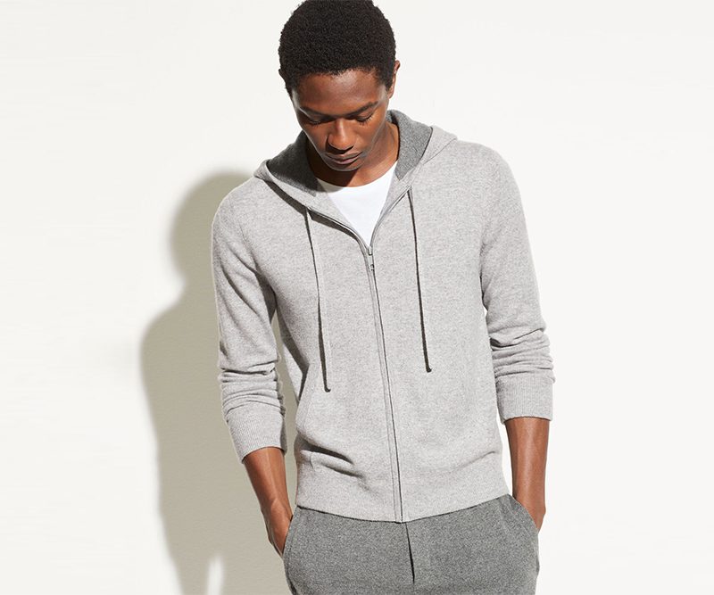Man wearing a grey cashmere hoodie and sweatpants.