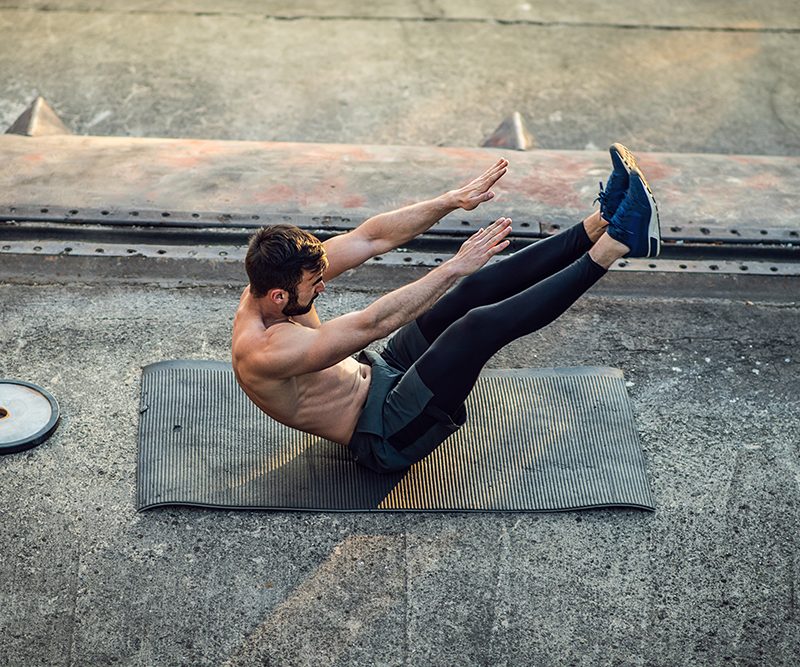 Man doing boat pose