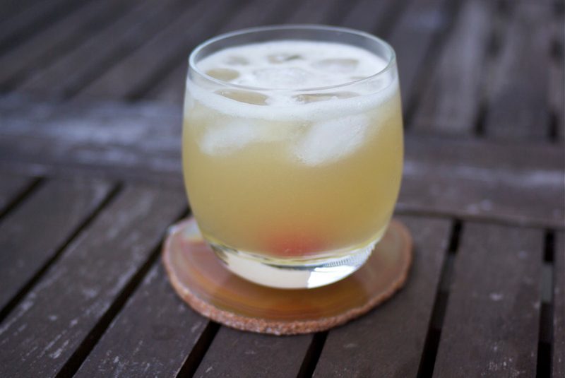 Whiskey sour outside on a table