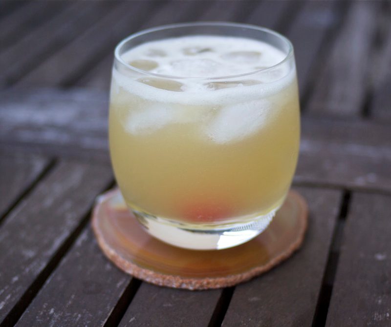 Whiskey sour outside on a table
